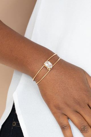 GLOW No Mercy - Gold - Paparazzi Accessories